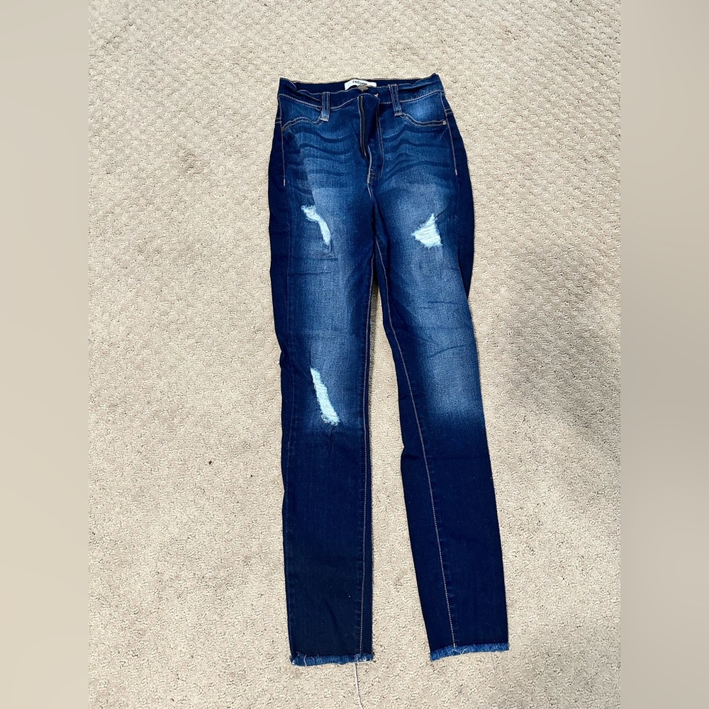 Dark wash skinny jeans with rips